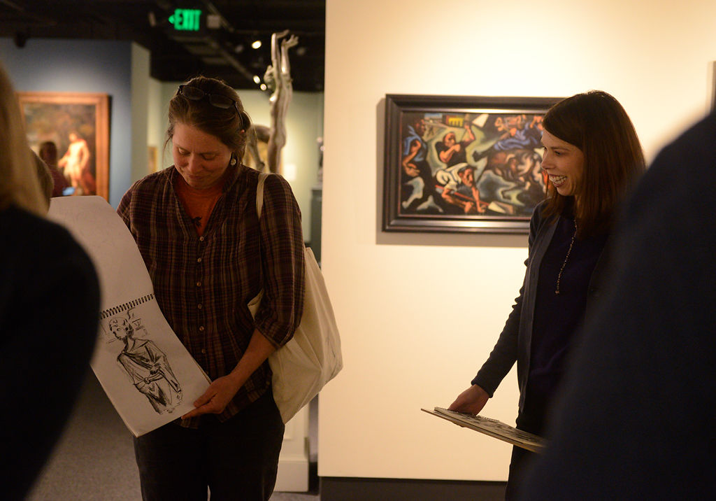 Jenn Muno shares her sketch with the rest of the group toward the end of their sketching session .jpg